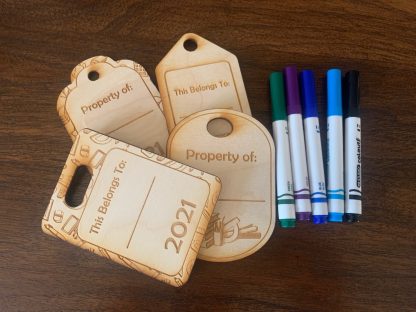 four set of property of and this belongs to laser engraved bag tags and four mrkers.