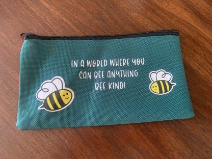 green pencil case with bees and saying: in a world where you can bee anything bee kind