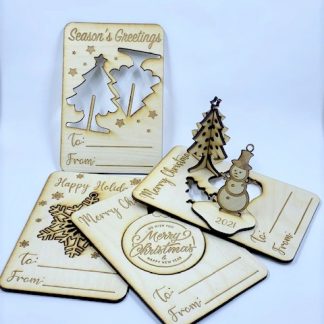 Four pack of laser engraved wooden 3d christmas cards: Tree, Snowman, snowflake and ornament.