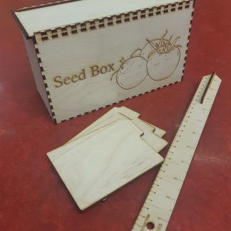 Laser cut and engraved box with the words 'seed box' and two engraved tomatoes on the front.