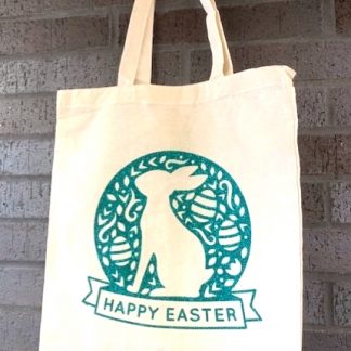 green glitter bunny decal with the words 'Happy Easter' on the bottom. Decal has been heat pressed onto a canvas bag.