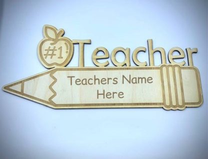 Laser cut sign in the shape of a pencil with the words '#1 teacher - teacher's name here'