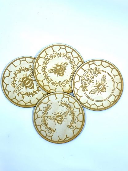Laser engraved wooden coasters with bee and flower design
