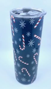 Blue Sublimation tumbler with snowflakes and candy canes on them