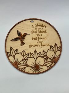 Laser engraved sign with mother quote and hummingbirds on it 