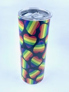 Sublimation Tumbler With Pride hearts and black background printed on it. 