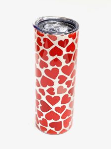 20 oz metal tumbler with red and pink heart sublimation pattern on it. 