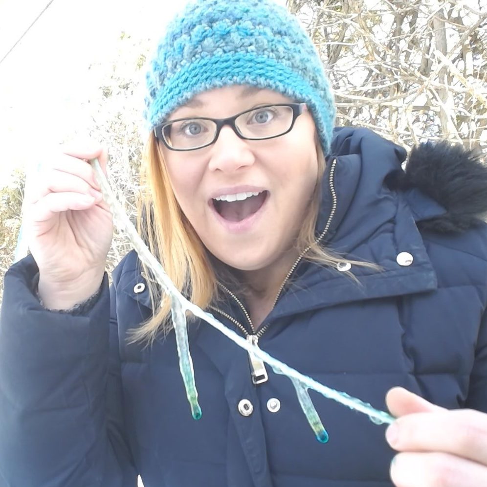 Person holding icicles on string