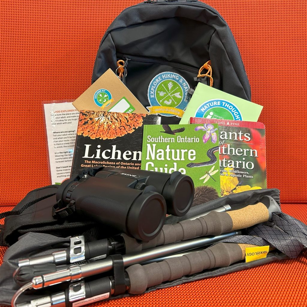 Explore Hiking & Nature Kit : Backpack for adults kit. Includes 3 books (Southern Ontario Nature Guide by Jeffrey Domm ; Plants of Southern Ontario by Richard Dickinson ; Lichens by Troy McMullin), 1 binoculars, 1 hiking poles, 1 journal, 1 crayon, 1 backpack. 